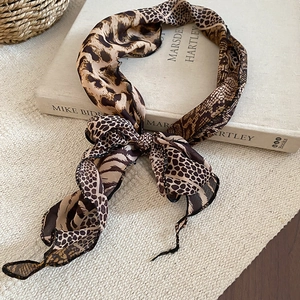 Close-up of leopard and snake print chiffon neck scarf with premium stitched edges