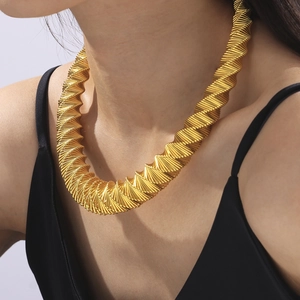 Chic gold-tone chunky ribbed spring choker necklace with geometric textured design
