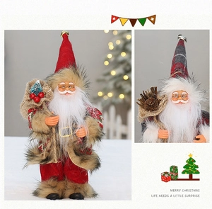 Detailed view of handmade plush Santa Claus doll featuring gray plaid hat and pine cone decor