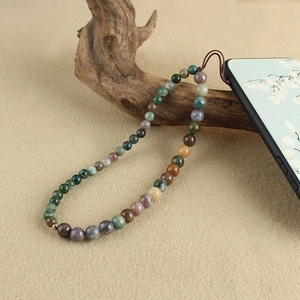 Ethnic beaded phone strap with natural turquoise and agate stones on zen wooden base