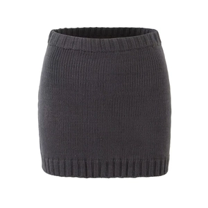 Detail of dark grey knit mini skirt with ribbed waistband and fine textured finish