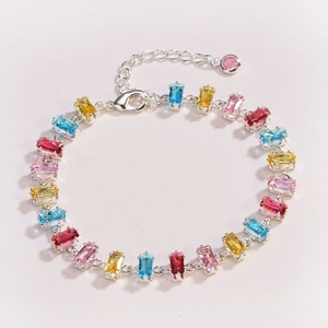 Close-up of a colorful zircon bracelet with silver chain and rectangle-cut stones
