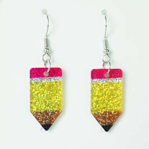 Detail of glitter wooden pencil earrings featuring colorful resin and silver metal hooks