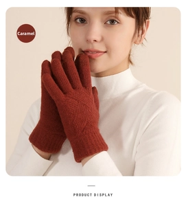 Detail view of winter knitted touch screen gloves in warm caramel color with thick lining