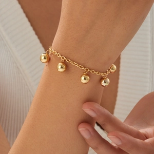 Gold plated stainless steel bead charm bracelet featuring five polished spherical pendants