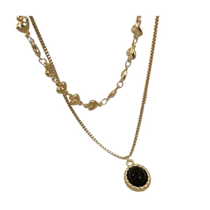 Gold-plated double-layer necklace with heart-shaped links and oval black gemstone pendant