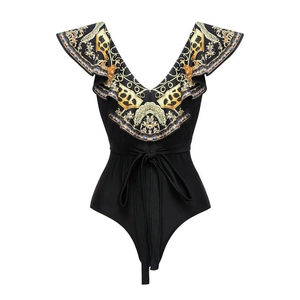 Detail of ruffled sleeves and baroque gold print on deep V-neck one-piece swimsuit