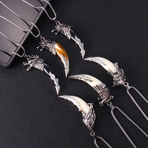 Vintage stainless steel necklaces with tribal wolf tooth pendants in multiple styles