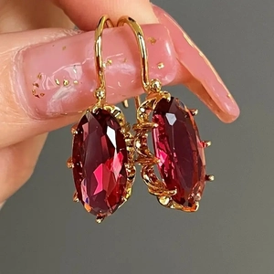 Elegant 18K gold-plated oval red gemstone earrings with intricate claw setting
