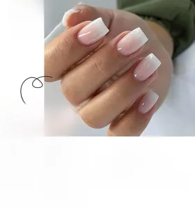 Detail of square french gradient press-on nails from translucent pink to milky white
