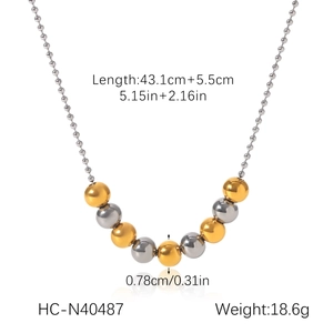 Detail view of two-tone gold and silver beaded Y-necklace with exact size and weight specs