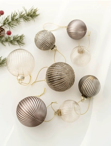 Detailed close-up of 6cm champagne glass Christmas ornaments with diverse textures and finishes