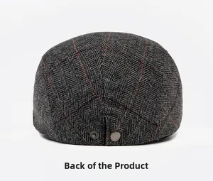 Rear view of herringbone tweed newsboy cap with red windowpane check and metal buckles