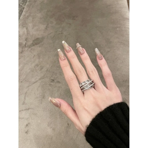 Elegant multi-layer silver zircon ring for women worn on finger with minimalist backdrop