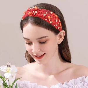 Red Halloween headband with black spider web pattern and sparkling rhinestones for party