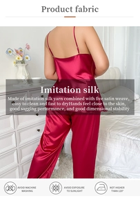 Detail of dark red faux silk pajama set showing thin straps and smooth satin fabric