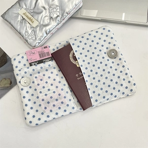 Detail of PU leather passport holder with bow showing card slots and inner compartments