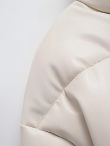 Macro detail of high-quality cream leather jacket texture and professional stitching finish