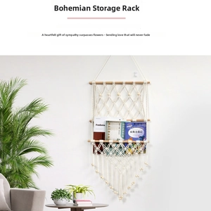 Detail of bohemian macramé wall hanging organizer with triple wood rods and cotton tassels