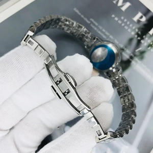Detailed macro view of the silver stainless steel watch strap with double butterfly clasp