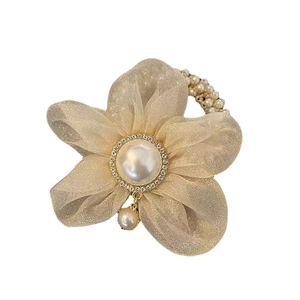 Élastique cheveux élégant en organza doré avec perle centrale et strass brillants décoré