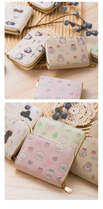 Detail of cute cartoon animal print card wallets with gold metal zipper and PU leather texture