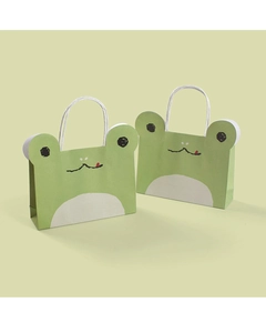 Detail view of cute green frog cartoon gift bags with durable white rope handles
