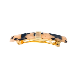 Elegant tortoiseshell acetate hair clip with a gold rhinestone centerpiece and metal base