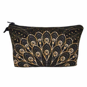 Detail of travel makeup bag with gold peacock feather pattern and durable black zipper