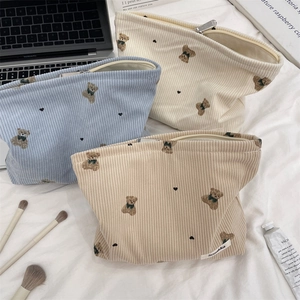 Detailed view of bear pattern corduroy makeup bags with sturdy metal zippers