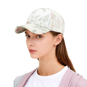 Detail of elegant white baseball cap with traditional Chinese floral jacquard patterns