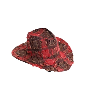 Vintage reddish brown patchwork western cowboy hat with distressed frayed edges and texture