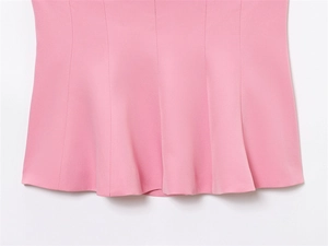Detailed view of the pink strapless top showing precise vertical stitching and fabric texture