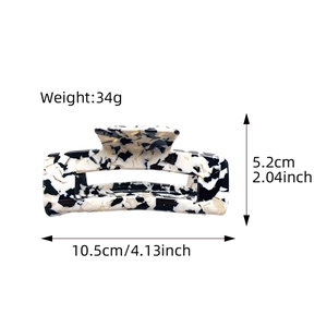 Large acetate hair claw clip with black and white marble pattern, 10.5cm long, 34g weight