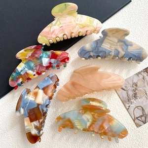 Detailed display of acetic acid shark hair clips in six assorted marble patterns