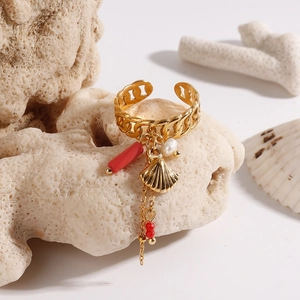 Golden open shell ring with chain texture, white pearl and red charm on coral