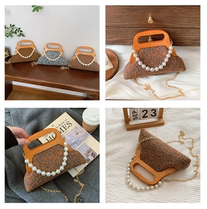 Detail of tweed evening bag featuring elegant wooden handles and pearl chain accents