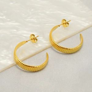 Classic gold stainless steel C-shape earrings with textured ribbing and minimalist style