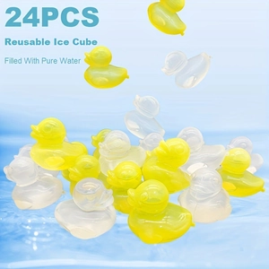 Close-up of duck-shaped reusable yellow and clear ice cubes splashing into water