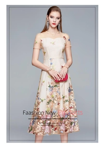Detailed embroidery on a high-waisted mesh midi dress with colorful floral patterns