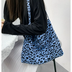 Blue leopard print corduroy tote bag with large capacity shown in a lifestyle setting