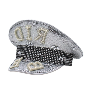 Detailed view of silver sequined captain hat with faux pearl initials and diamond trim
