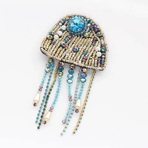 Exquisite jellyfish brooch detail with Miyuki beads, rhinestones, and white pearls