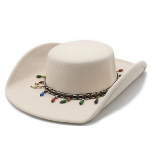 Detail of western fedora hat featuring geometric woven band and colorful bead tassels