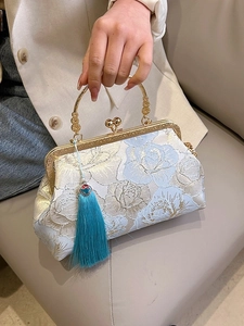 Elegant floral embroidery handbag with blue rose patterns and luxury silk tassel