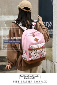 Detailed back view of a floral print backpack with brown leather accents and soft straps