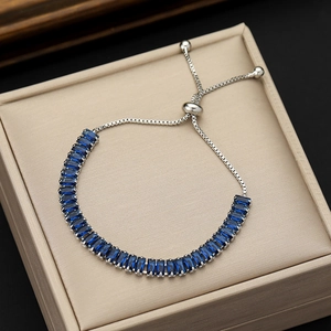 Adjustable silver box chain bracelet with 24 blue rectangular zircon stones on leather