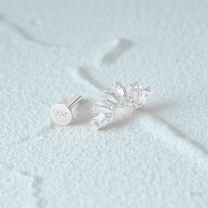Macro shot of S925 sterling silver flat back earring with fan-shaped zircon stones