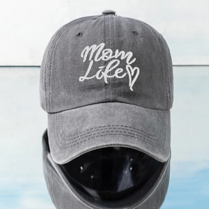 Close-up of MOM LIFE letter embroidery and heart detail on gray washed cotton baseball cap