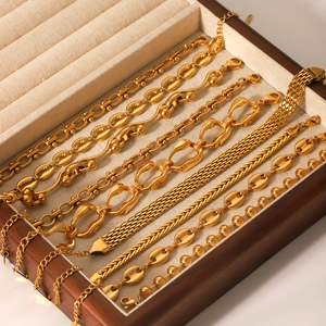 18K gold plated stainless steel bracelet set with assorted link styles in a jewelry box